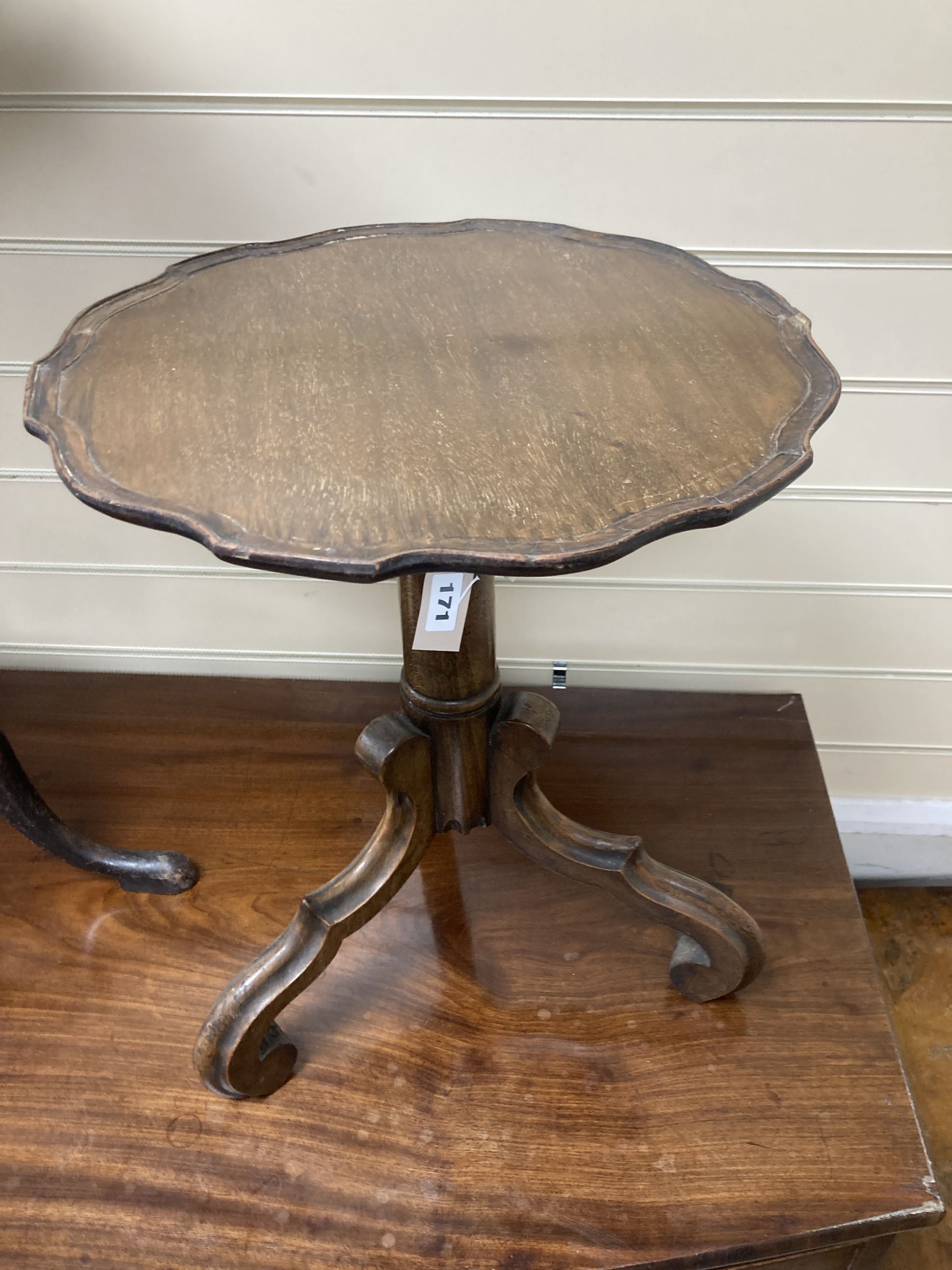 A carved walnut occasional table on tripod base, diameter 38cm, height 47cm